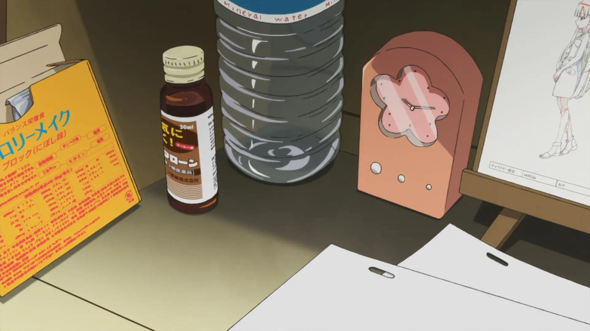 Segawa's desk: an energy drink/supplement (?) and a clock displaying ~10:14.