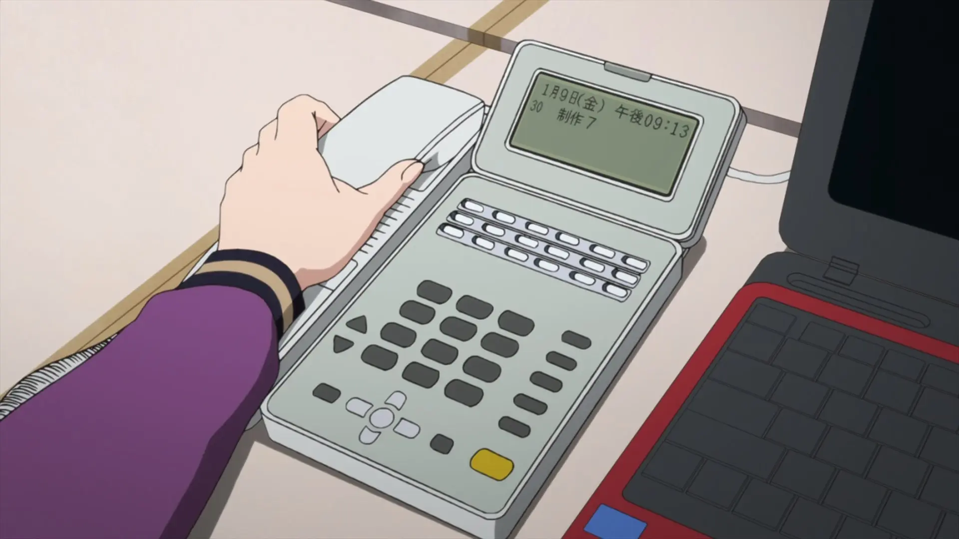 Aoi's desk phone displaying January 9, 9:13.